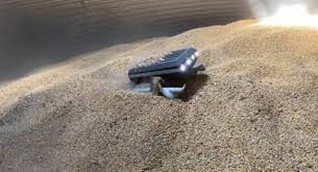  (The newly introduced Grain Weevil Robot navigating around a grain bin)